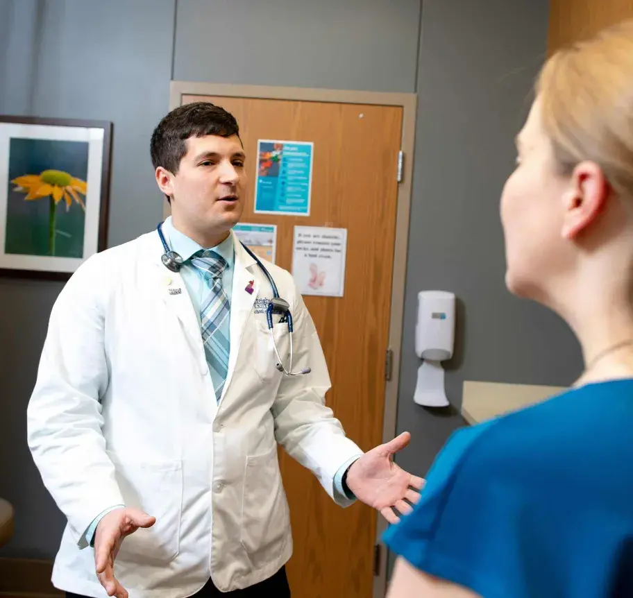 Physician assistant faculty working with student