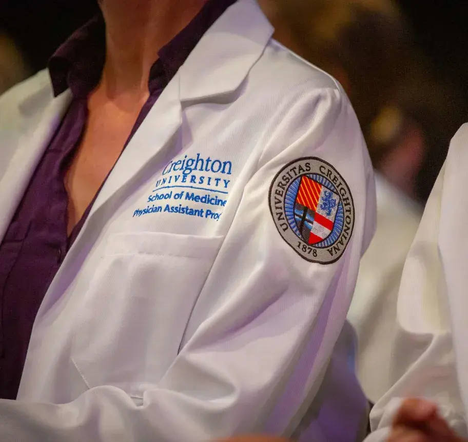 Physician assistant student white coat