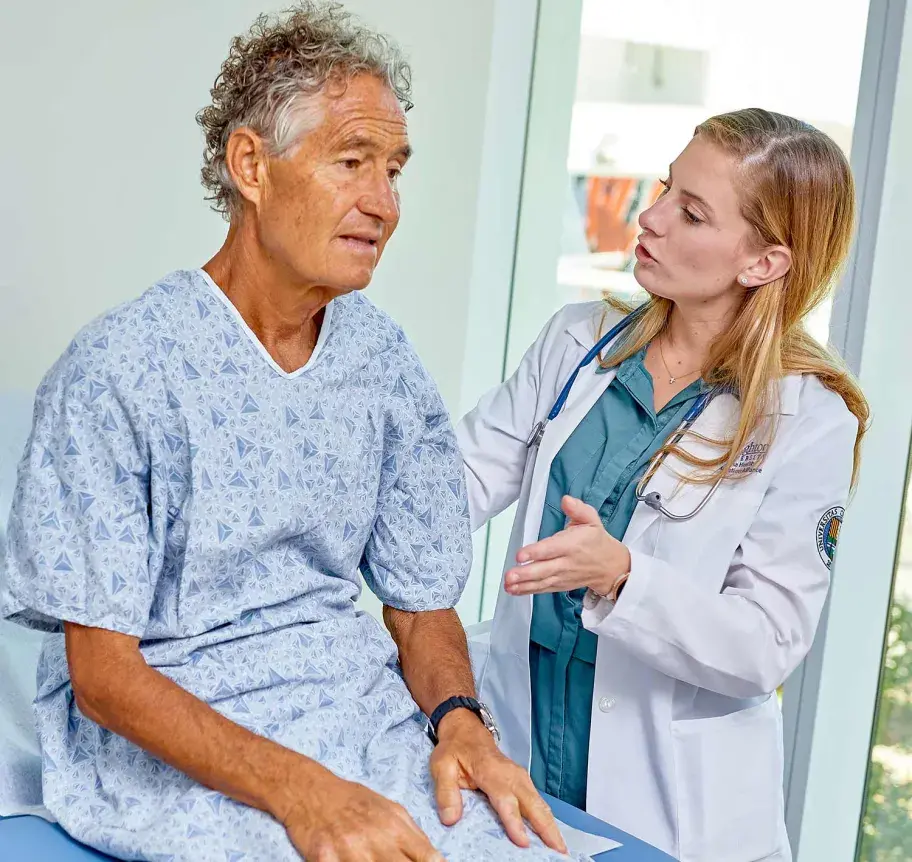 Physician assistant student working with patient
