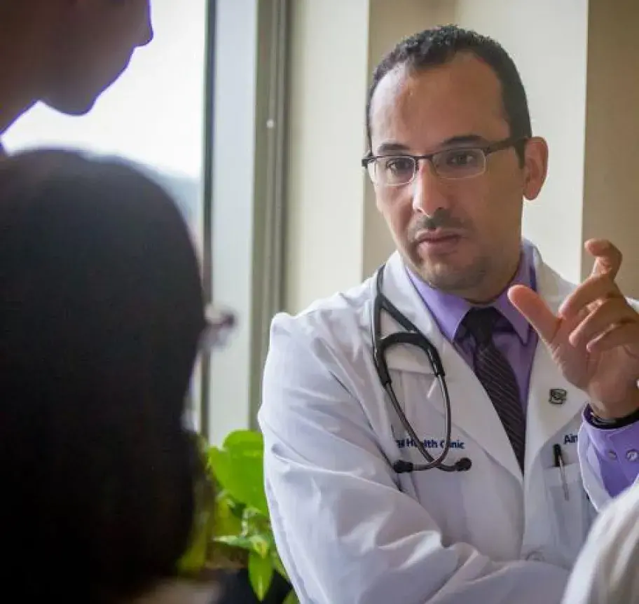 A health care professional speaking to patients
