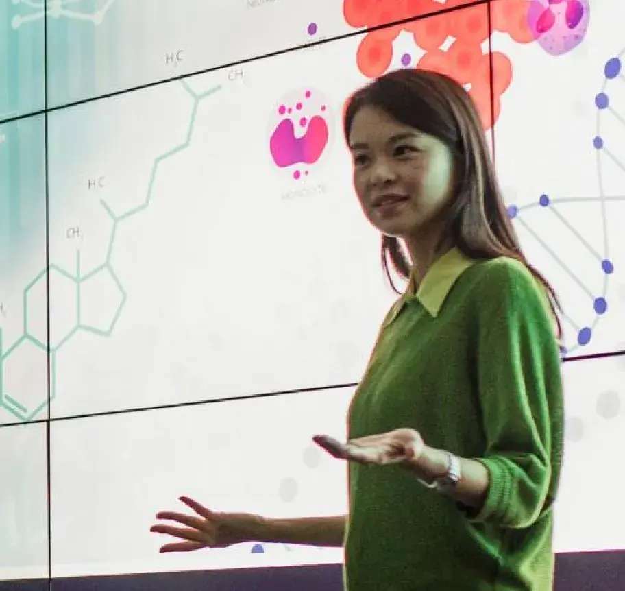 A woman presenting on biomedical sciences