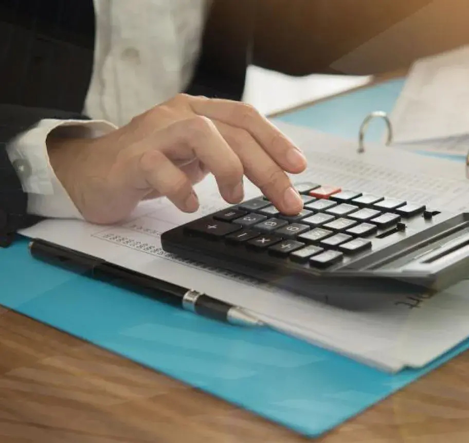 A person using a calculator for accounting purposes