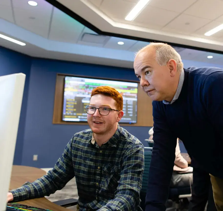 Faculty and student in business classroom