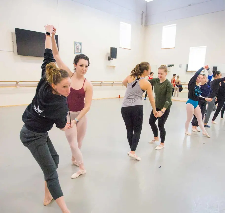 Students with partners in dance class