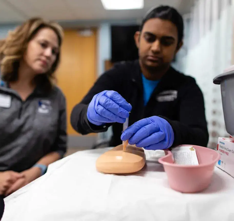 Nursing students practicing skills