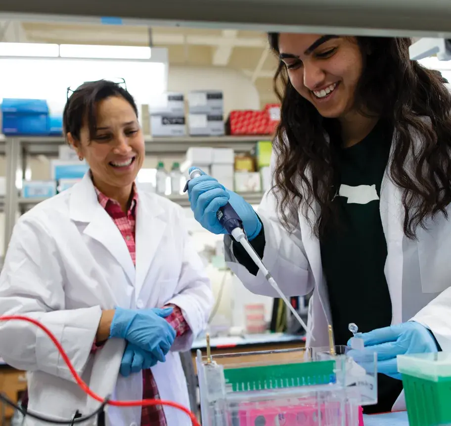 Creighton students with faculty in science lab
