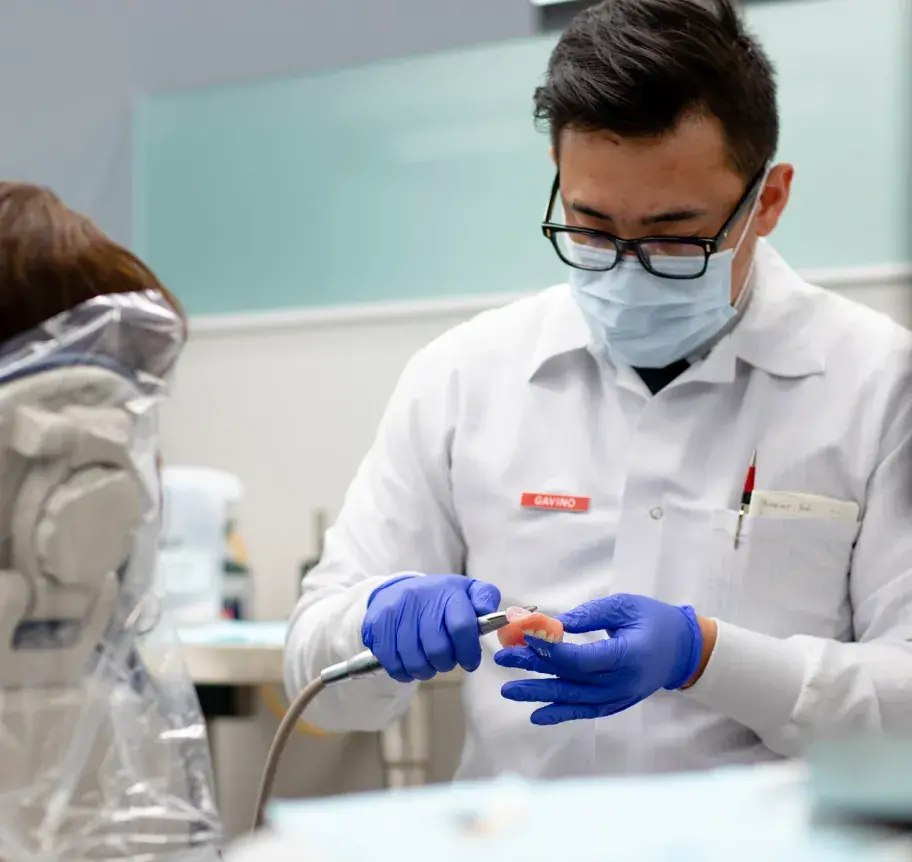 Dentistry student working in Creighton Dental Clinic