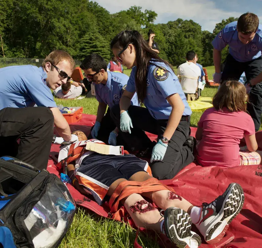 Emergency medical services team assessing accident victims
