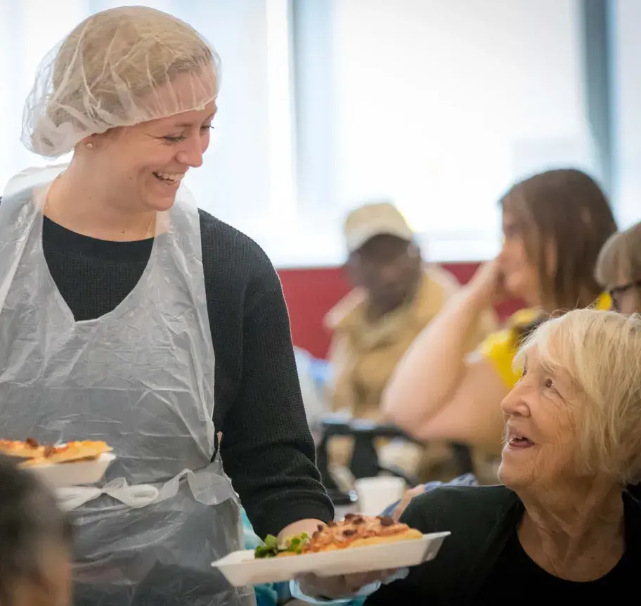 Volunteer serving meals