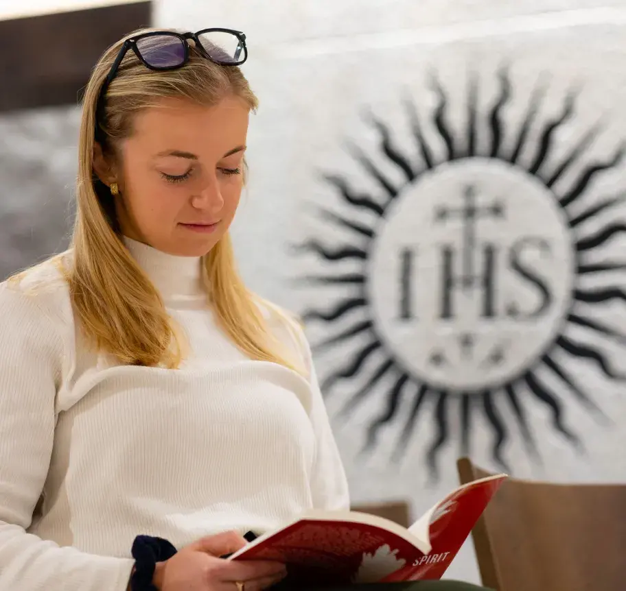 Student reading at Creighton