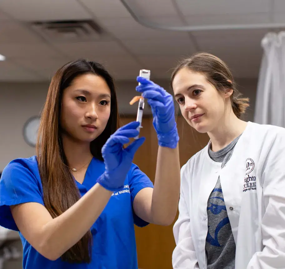 Nursing student and faculty working together