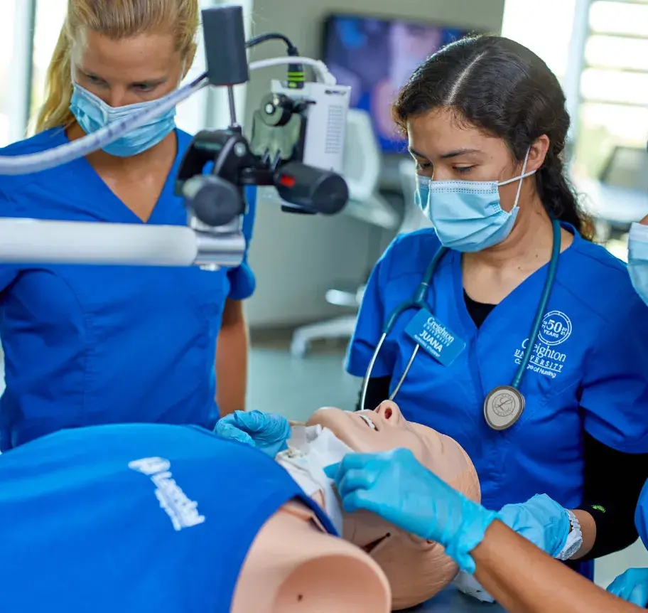 Nursing students learning on interactive equipment
