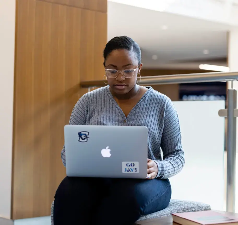 Student working on laptop at Creighton