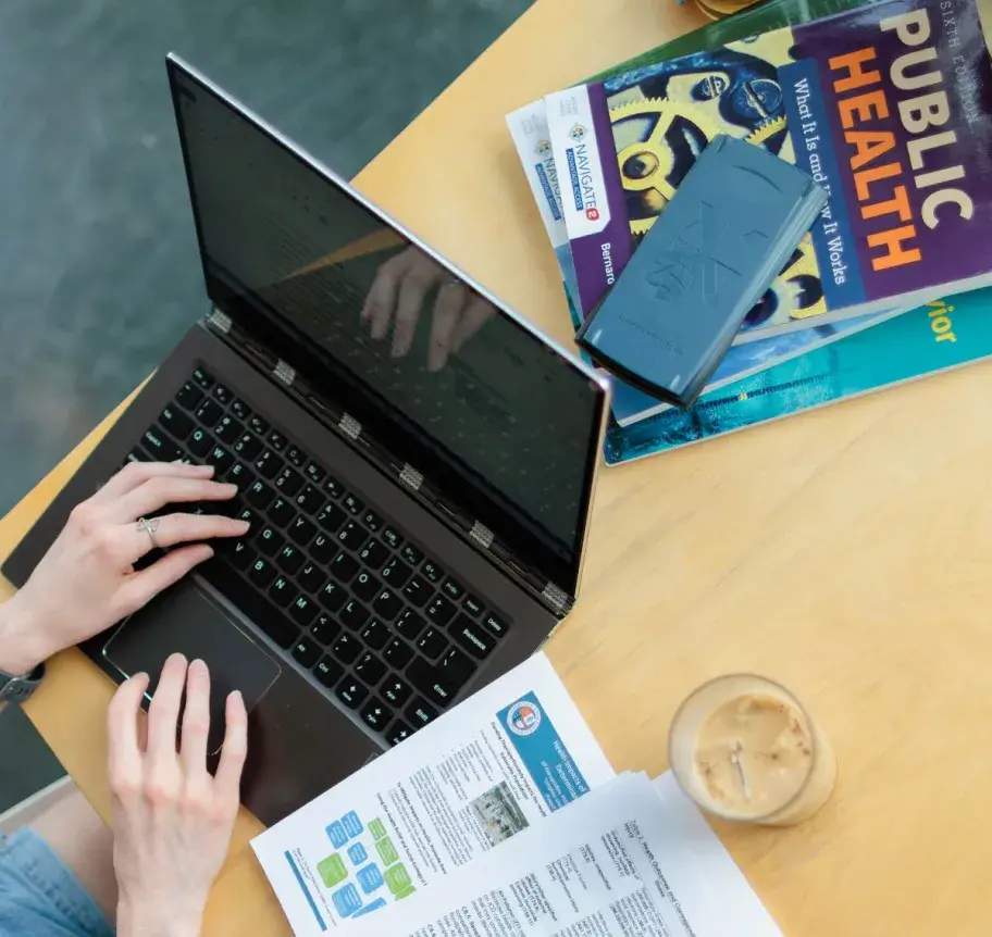 Master of Public Health student working at laptop
