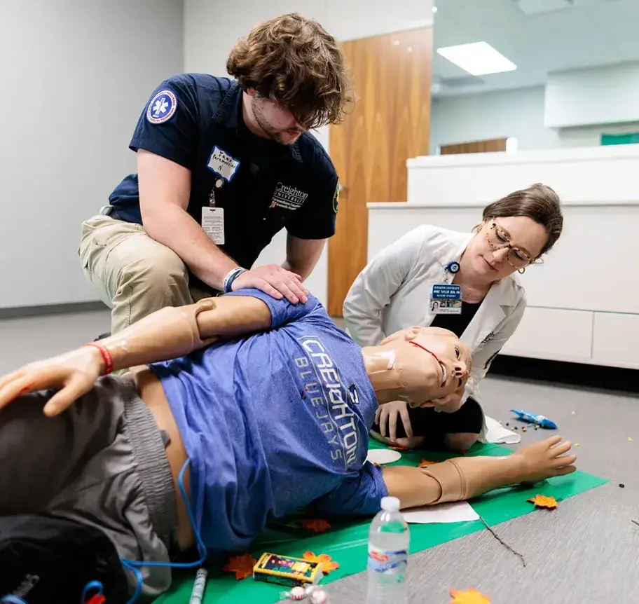 Practicing EMS care on dummy patient.