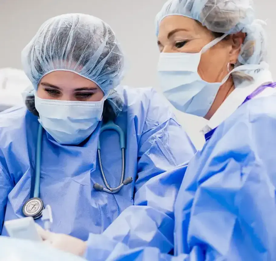 Nurses applying anesthesia to patient