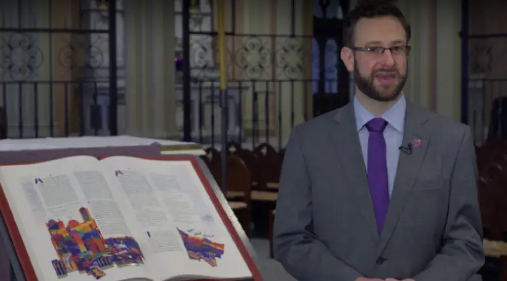Video thumbnail featuring Chase Becker next to the St. John's Bible