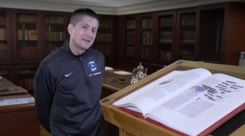 Video thumbnail featuring Ross Paule next to the St. John's Bible