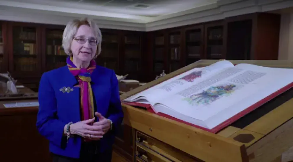 Video thumbnail featuring Susan Naatz next to the St. John's Bible