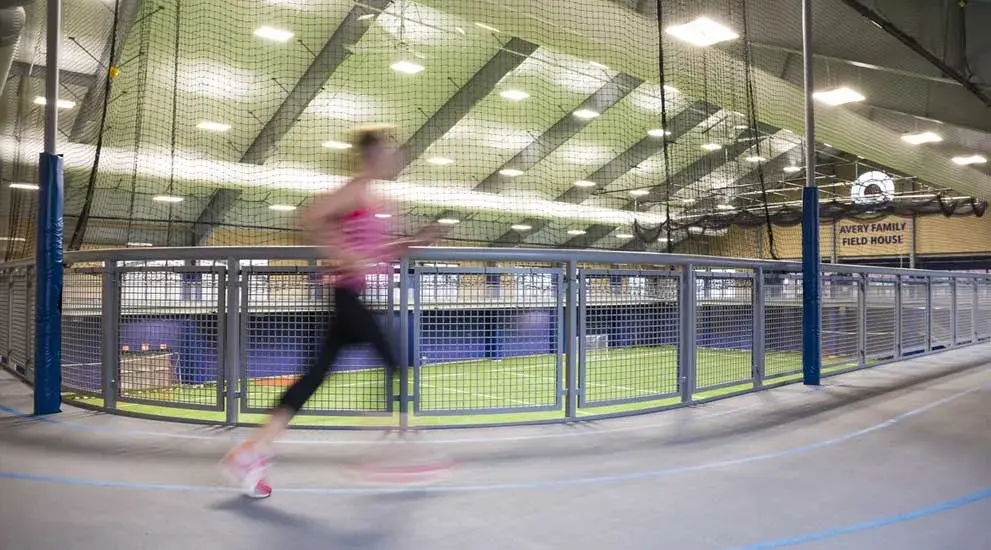Student running on track.