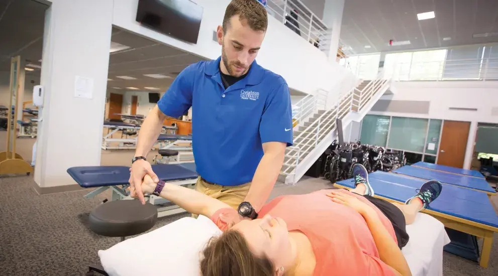 Student treating patient's arm