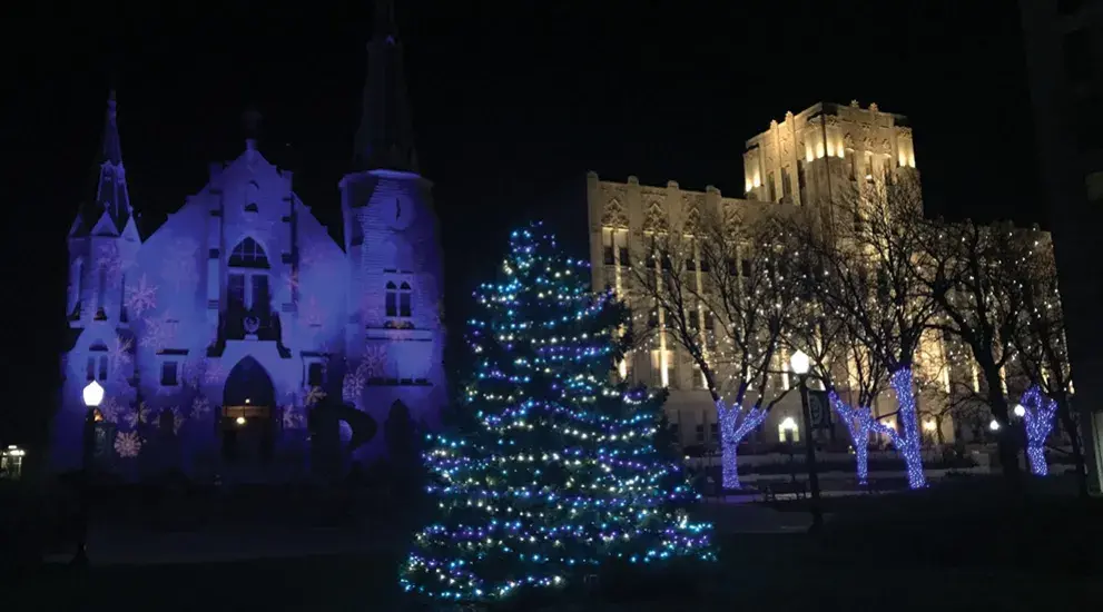 Christmas lights outside St. John's church at night.