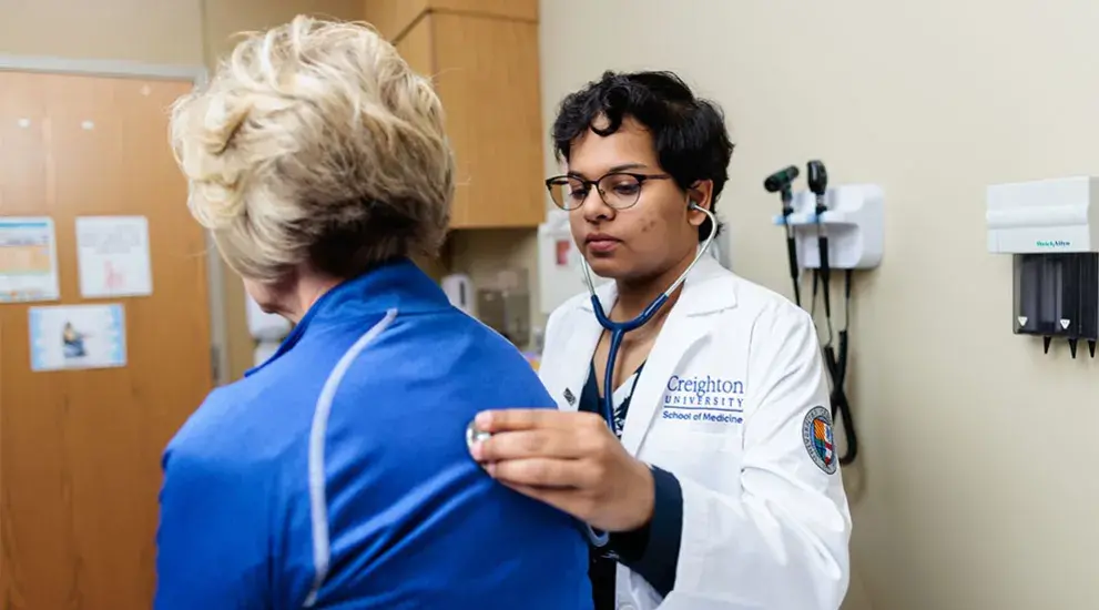 Graduate medical student performing research
