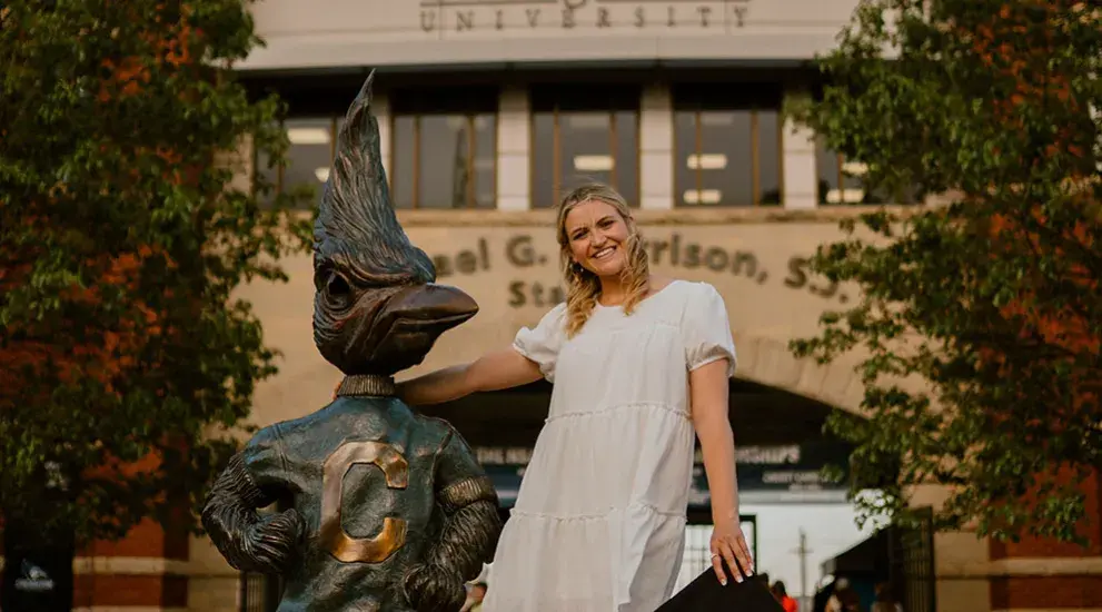 Clara Korensky by Billy Bluejay statue.
