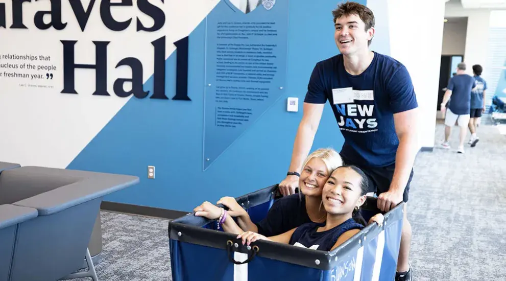 Move in students sitting in cart