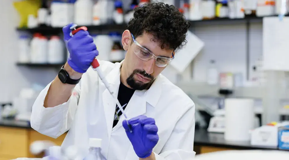 Scientist pipetting