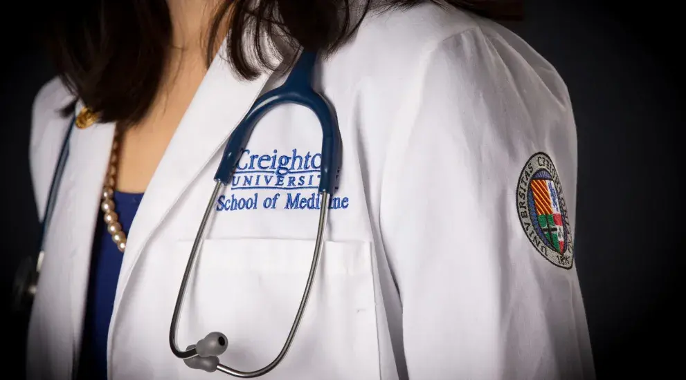 White coat with badge showing