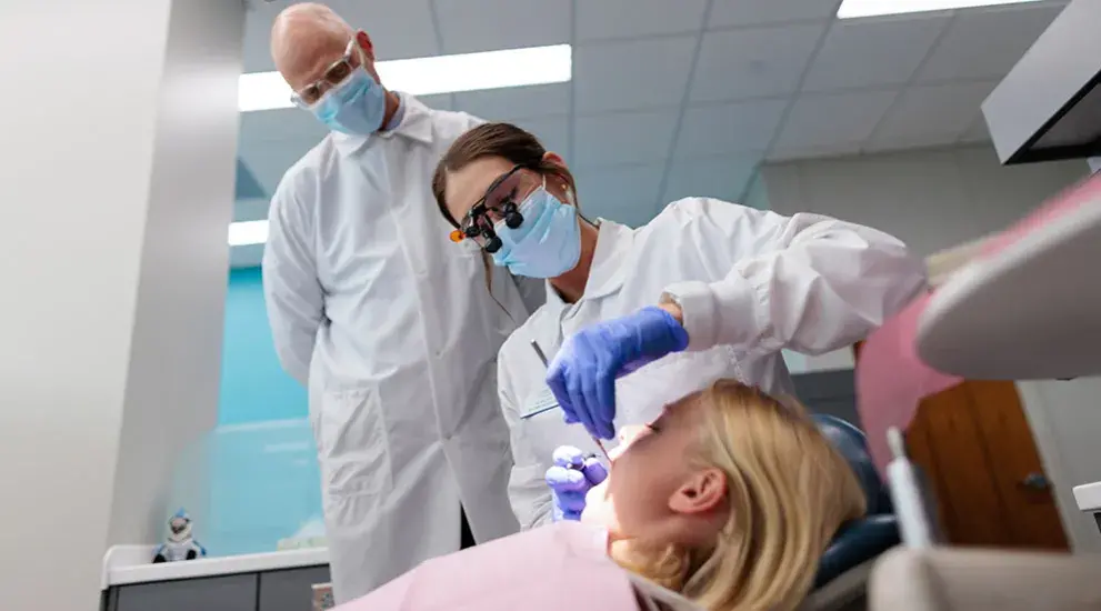 Dental student helped by professor