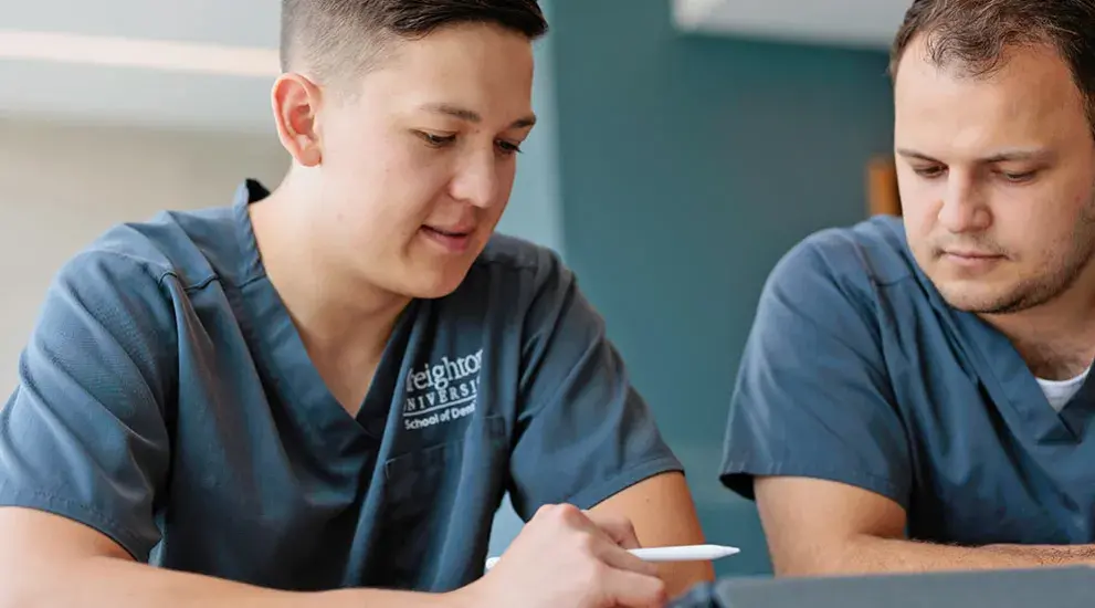 Dental students discussing results