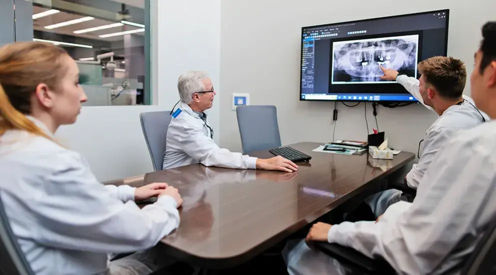 Dental students looking at xray