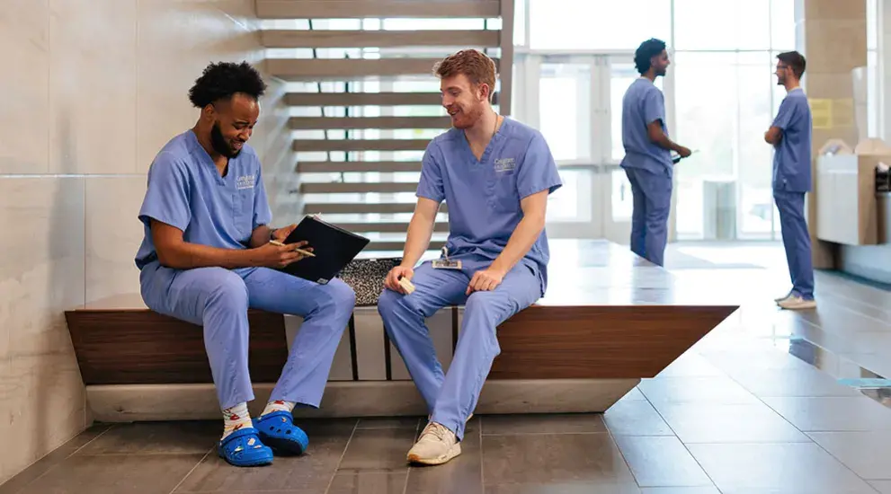 Dental students talking in hallway