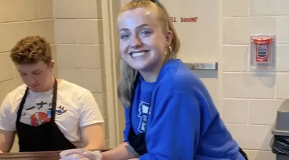 Alexis Johnson working at Siena Francis House