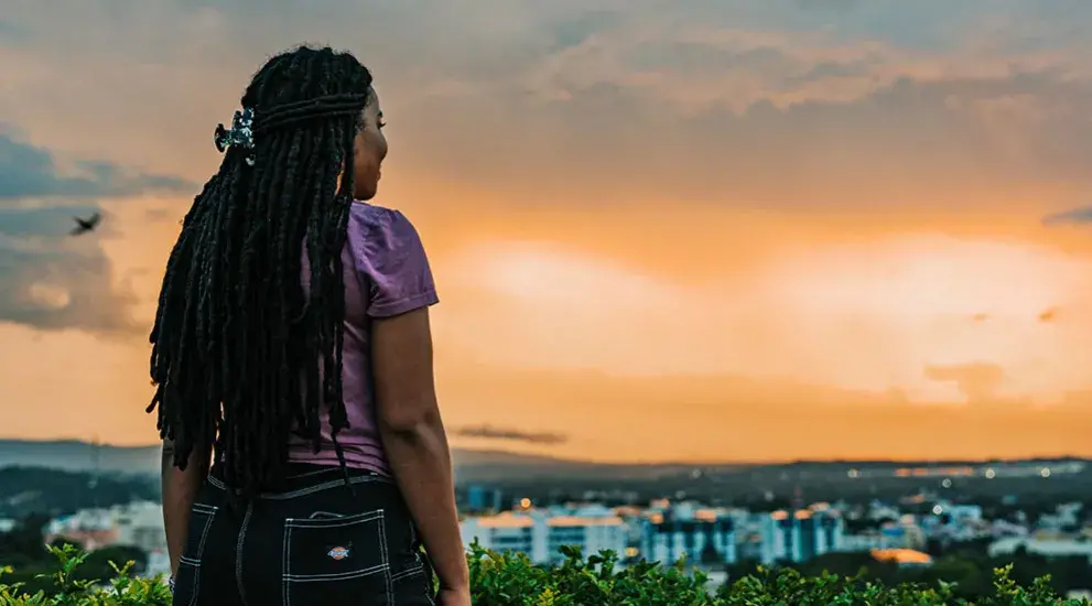 Student looking over city skyline