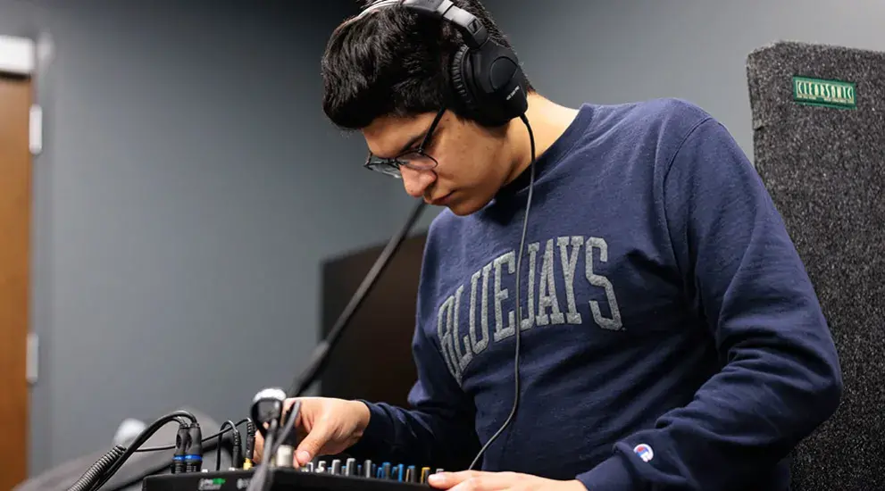 Student working with a/v equipment