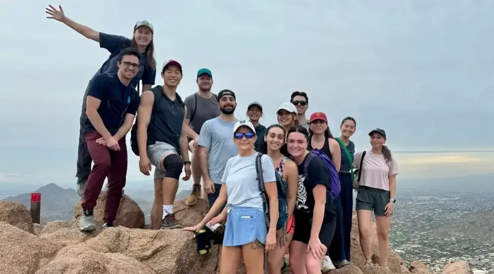 Students on outdoor adventure posing in group picture