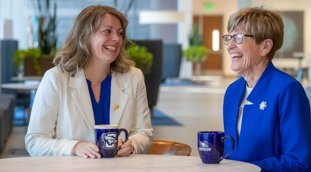 Lappe and Kirkpatrick laughing together.
