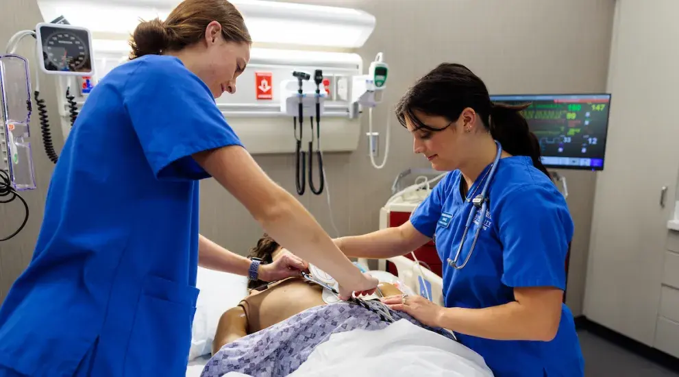Two nursing students in training.