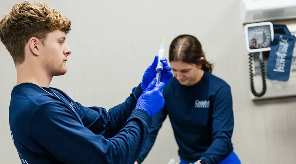 Students doing paramedicine simulation