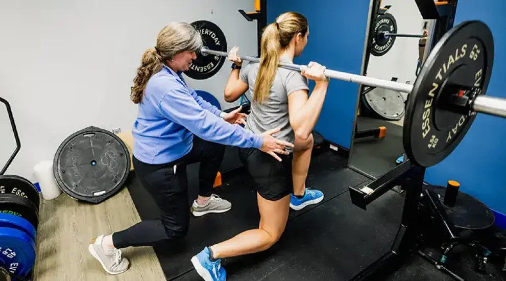 Therapist assisting in physical therapy session