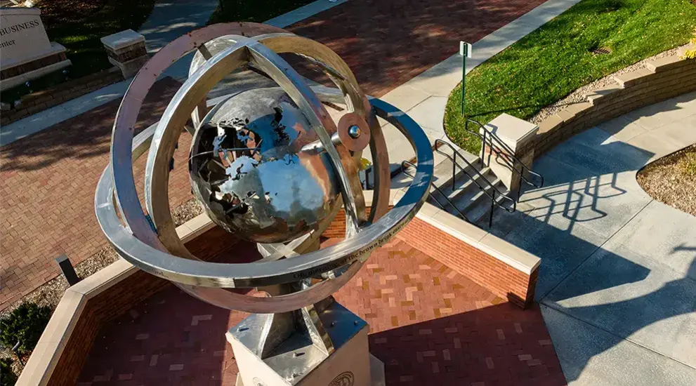 Globe statue on campus