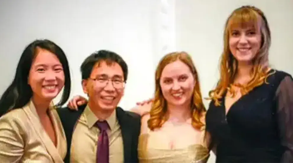 2024 General Surgery Residency graduation photo featuring four residents in formal evening wear celebrating their completion of the program.