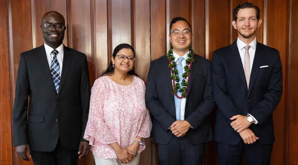 2025 General Surgery Residency graduation photo featuring four residents in formal evening wear celebrating their completion of the program.