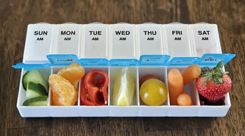 Fruit in a pill case.