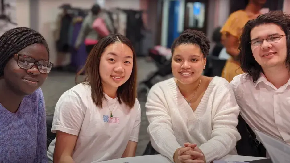 Trio students smiling in group show
