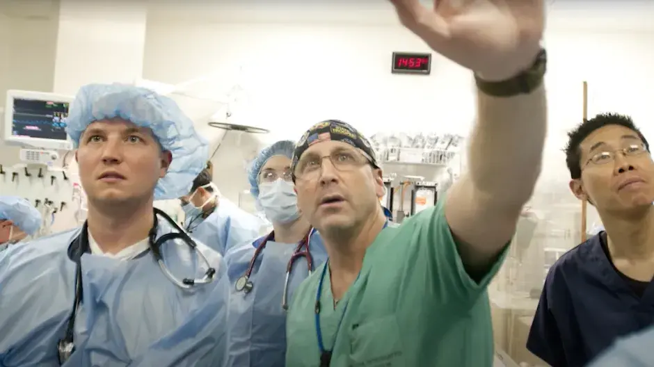 Dr. Vail working in trauma situation with teammates.