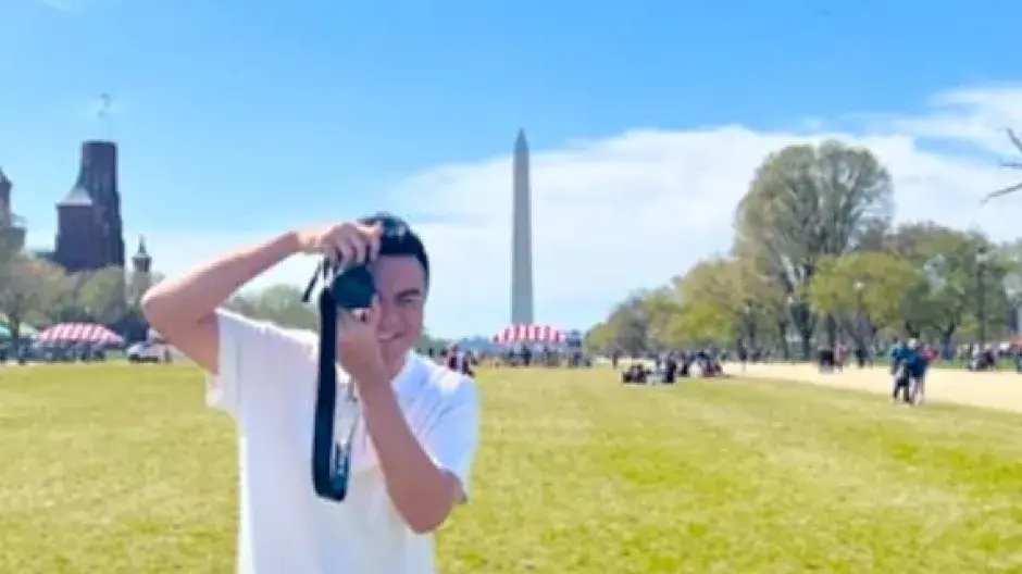 Frankie Pastor-Rivera taking photos on Washington mall